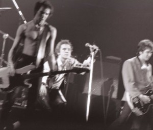 sex-pistols-last-show Taken at the Winterland Ballroom, January 1978. Vicious to the left is shirtless while Rotten (center) is decked out trying to upstage Jones (right). To see a video of the concert, click here